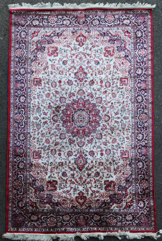 A Turkish part silk rug, 7ft 8in by 5ft.